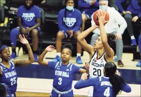  ?? David Butler II / USA TODAY ?? UConn’s Olivia Nelson-Ododa (20) shoots against Seton Hall on Wednesday in Storrs.