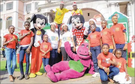  ??  ?? First Lady of Lagos State, Mrs. Ibijoke Sanwo-Olu (middle) and wife of the Deputy Governor, Mrs. Oluremi Hamzat, in a group photograph with some kids, during the first lady’s children end-of-the-year party, at the Parliament field, Lagos House, Marina…….yesterday