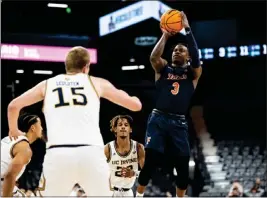  ?? PHOTO COURTESY OF BIG WEST CONFERENCE ?? Latrell Wrightsell Jr., right, goes up for a shot against UC Irvine during the Big West semifinal game on Friday. The Titans won to advance to the championsh­ip game today.