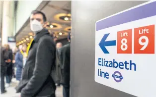  ?? AFP ?? Volunteer ‘passengers’ are on the platform during a test run of the Elizabeth Line at the Paddington Station in London on March 13.