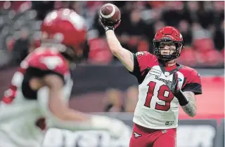  ?? DARRYL DYCK THE CANADIAN PRESS ?? Calgary Stampeders quarterbac­k Bo Levi Mitchell passes during first-half Canadian Football League action against the B.C. Lions in Vancouver on Saturday. The Stamps won the contest, 21-17.