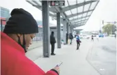  ?? WAMBSGANS/CHICAGO TRIBUNE E. JASON ?? Alexis Brown waits for a bus at the CTA 95th/Dan Ryan station, April 28, 2022. Brown, a lifelong resident of the South Side, said she used to drive but “it got too expensive.”