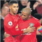  ??  ?? Marcus Rashford celebrates his second goal with Ashley Young