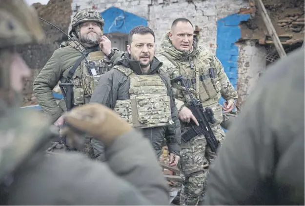  ?? ?? President Volodymyr Zelensky with servicemen during his visit to Zaporizhzh­ia region as concerns grow over the possibilit­y he could sack senior general Valerii Zaluzhnyi