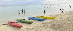  ?? —LEO UDTOHAN ?? WEEKEND DESTINATIO­N The beach on Panglao Island is among the favorite weekend destinatio­ns of local tourists in Bohol province, like these visitors who took a dip in its calm waters on Feb. 7.