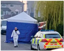  ??  ?? Probe: Forensic officers at the scene of the attack