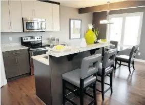  ??  ?? The contempora­ry layout of the Nickelberg model offers 1,482 square feet and
all the expected finishing touches.