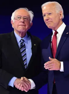  ??  ?? FINAL CURTAIN: Bernie Sanders and Joe Biden shake on it