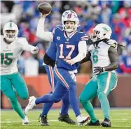  ?? Adrian Kraus/Associated Press ?? Buffalo Bills quarterbac­k Josh Allen looks to pass during the second half of the AFC wild-card playoff game against the Miami Dolphins last Sunday in Orchard Park, N.Y.