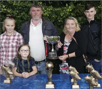  ??  ?? The family of the late Thomas Murphy with the cup named in his honour: (from left) Sadie, Alice, John, Mary and Michael Murphy.