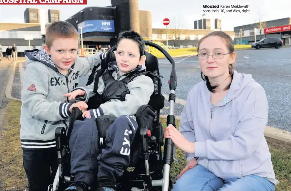  ??  ?? Worried Karen Meikle with sons Josh, 10, and Alex, eight