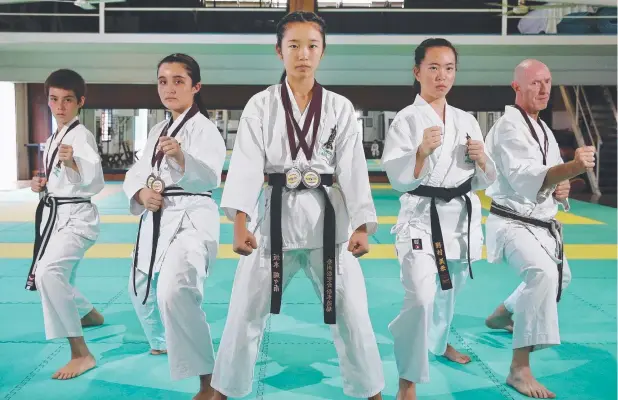  ?? Pictures: BRENDAN RADKE ?? MEDAL HAUL: Matsumoto Karate Academy’s Eoghan Kuiper, Katelyn Row, Cocona Sakamoto, Mikoto Nomura and Mark Porter.