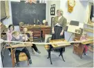  ?? SPECIAL TO THE EXAMINER ?? Young visitors to the Asphodel-Norwood Historical Society’s new One Room School House Exhibit had an opportunit­y to experience what it was like to attend class nearly a century ago. Rachelle and Ryan Tweedie (at the back) look like they have completed...