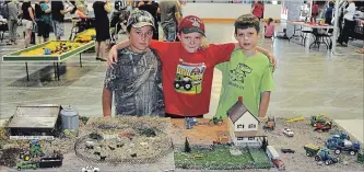  ?? SUBMITTED ?? A group of future farmers (ltor) Steele Christie, Aiden Vanderhost, Gordon Jones, (missing at the time of the picture was Blake and Jack Reed) proudly display a very realistic miniature that they created of a typical farm operation at the recent...