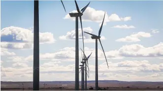  ??  ?? Wind farms such as this TransAlta facility near Pincher Creek create jobs during the constructi­on phase but communitie­s looking to diversify their economy know few workers are needed to maintain the turbines.