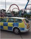  ??  ?? A police car at the scene at Drayton Manor