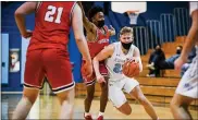  ?? MEDIANEWS GROUP PHOTO ?? North Penn’s Josh Jones (23) pushes past Souderton’s Shaun Purvy (2) during a recent game.