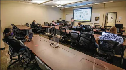  ?? BRANDEN CAMP FOR THE AJC ?? Kennesaw State University Professor Dr. Maria Valero teaches a socially distanced Informatio­n Technology class Wednesday in Marietta. Demand for young Black tech talent may soon outpace supply if institutio­ns of higher education can’t keep up.