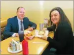  ??  ?? Ed Roth, principal of Norristown Area High School, and writer Katie Kohler square off on pizza.