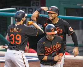  ?? AP Photo/Manuel Balce Ceneta ?? ■ Baltimore Orioles' Renato Nunez (39) celebrates with teammate Anthony Santander (25) after hitting a three-run home run during the sixth inning of a baseball game Friday against the Washington Nationals in Washington.