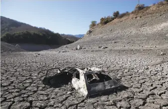  ?? Michael Short / The Chronicle 2014 ?? Receding waters are seen in 2014 at the Almaden Reservoir, the artificial lake in the hills south of San Jose. The past six years have been unquestion­ably the warmest since 1880.