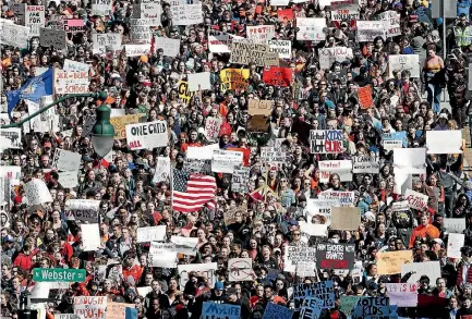  ?? PHOTO: AP ?? Students in Madison, Wisconsin join the mass school walkout across the US, one month after the deadly shooting at a high school in Parkland, Florida.