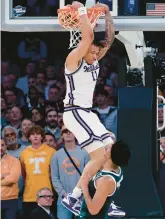  ?? ADAM HUNGER/AP ?? Kansas State forward Keyontae Johnson dunks the ball in overtime of a Sweet 16 game against Michigan State on March 23 in New York.