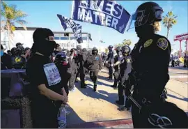  ?? Nelvin C. Cepeda San Diego Union-Tribune ?? SAN DIEGO police are deployed at a pro-Trump rally on Jan. 9, 2021. Some of the rally participan­ts had been present at the U.S. Capitol attack three days earlier.