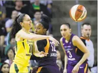  ?? Elaine Thompson / Associated Press ?? The Storm’s Sue Bird, left, passes as the Mercury’s Briann January (12) and Diana Taurasi (3) defend in an Aug. 26 game.