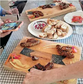  ?? [PHOTO BY SALLY HALE, AP FILE] ?? A spread of food from Smith Brothers Butcher Shop in Savannah, Georgia, seen in April, offered as part of the popular Famous & Secret East Side Food Tour. The three-hour walking tour combines history lessons with stops for a tasty bite at six...