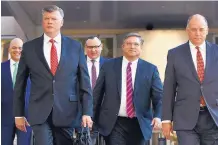  ?? JACQUELYN MARTIN/ASSOCIATED PRESS ?? Members of Paul Manafort’s defense team, from left, Jay Nanavati, Kevin Downing, Brian Ketcham, Richard Westling and Thomas Zehnle, walk to court in Alexandria, Va., on Tuesday.