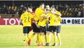  ?? MERLINDA PEDROSA/SUNSTAR PHILIPPINE­S ?? Players of Ceres-Negros celebrate following a goal against Myanmar’s Shan United in their AFC Cup 2019 opening match at the Panaad Stadium in Bacolod City on Tuesday night.