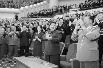  ??  ?? Kim claps during a celebratio­n for nuclear scientists and engineers who contribute­d to a hydrogen bomb test, in this undated photo released by North Korea’s Korean Central News Agency (KCNA) in Pyongyang. — Reuters photo