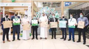  ??  ?? Officials taking part in the initiative at a LuLu Hypermarke­t outlet.
Right: Awareness messages at a Carrefour outlet.