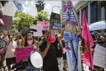  ?? IRFAN KHAN/LOS ANGELES TIMES/TNS ?? Supporters of Britney Spears rally as a hearing on the Britney Spears conservato­rship case takes place at Stanley Mosk Courthouse in Los Angeles on June 23.