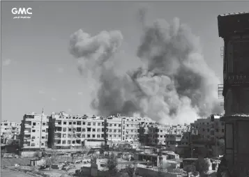  ?? GHOUTA MEDIA CENTER VIA AP ?? THIS PHOTO RELEASED ON FRIDAY BY THE SYRIAN ANTI-GOVERNMENT activist group Ghouta Media Center, which has been authentica­ted based on its contents and other AP reporting, shows smoke rising after Syrian government airstrikes hit Ghouta, suburb of...