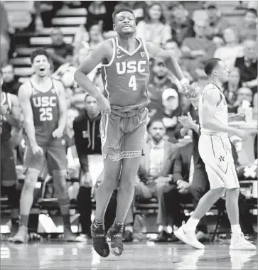  ?? Mark Humphrey Associated Press ?? CHIMEZIE METU (4) of No. 10 USC reacts after making a shot in overtime to help beat Vanderbilt.