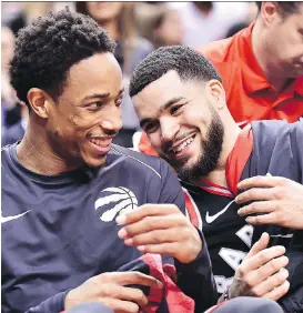  ?? FRANK GUNN/ THE CANADIAN PRESS ?? Raptors guards DeMar DeRozan and Fred VanVleet share a laugh late in their 133-99 rout of the Cleveland Cavaliers in Toronto Thursday. The Raptors, without starters Kyle Lowry and Serge Ibaka, got a career-high 22 points from VanVleet and a modest 13...