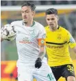  ?? FOTO: DPA ?? Verwandelt­e den finalen Elfmeter: Max Kruse (li. im Duell mit Dortmunds Julian Weigl).