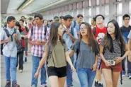  ?? ASSOCIATED PRESS FILE PHOTO ?? Students arrive for the first day of school at Stuyvesant High School in 2015 in New York.