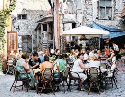  ?? RICK STEVES/RICK STEVES’ EUROPE ?? Estonians enjoy a collective culture — and that includes sharing food and drink. is full of restaurant­s and cafes. Tallinn