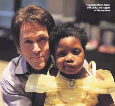  ??  ?? Tragic tale: Mitch Albom with Chika, the subject
of his new book