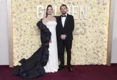  ?? Jordan Strauss/Invision/AP ?? Lily Gladstone and Leonardo DiCaprio arrive at the Golden Globe Awards on Sunday.