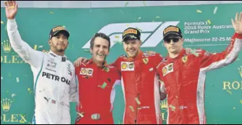  ??  ?? Ferrari's Sebastian Vettel (second from right) at the Australian GP podium with thirdplace­d Kimi Raikkonen (right) and Lewis Hamilton (left) on Sunday.