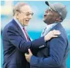  ?? BRYNN ANDERSON/ AP ?? Dolphins owner Steve Ross, left, and GM Chris Grier must deal with a reduced NFL salary cap in 2021.