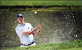  ?? NATHAN DENETTE — THE CANADIAN PRESS VIA AP ?? Matt Kuchar hits out of the bunker on the fourth hole during the second round of the Canadian Open Friday in Oakville, Ontario.