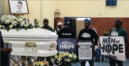  ??  ?? Men of Hope surroundin­g Karabo Mokoena’s coffin at her funeral. Pictures: Simphiwe Mbokazi