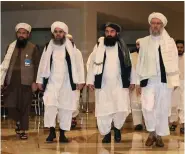  ??  ?? Members of the Taliban delegation in Doha for peace talks.