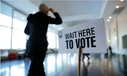  ?? ?? A voter prepares to cast their ballot in the presidenti­al primary election in Atlanta, Georgia, on 12 March. Photograph: Alex Slitz/EPA