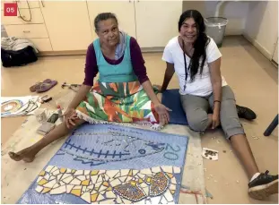  ?? Photo: Vanessa Margetts ?? 05 05Terricit­a Corpos and Lorraine Hunter working on a mosaic to be installed at Liyan-ngan Nyirrwa (Cultural Healing Centre).